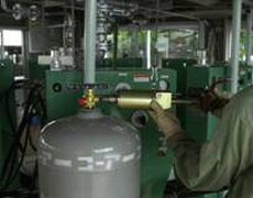 Filling LP Gas into a cylinder by way of blow by pass-system